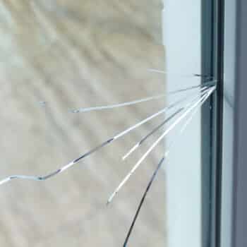 crack-on-the-glass-at-a-residential-house-plastic-window-is-damaged-by-cracks
