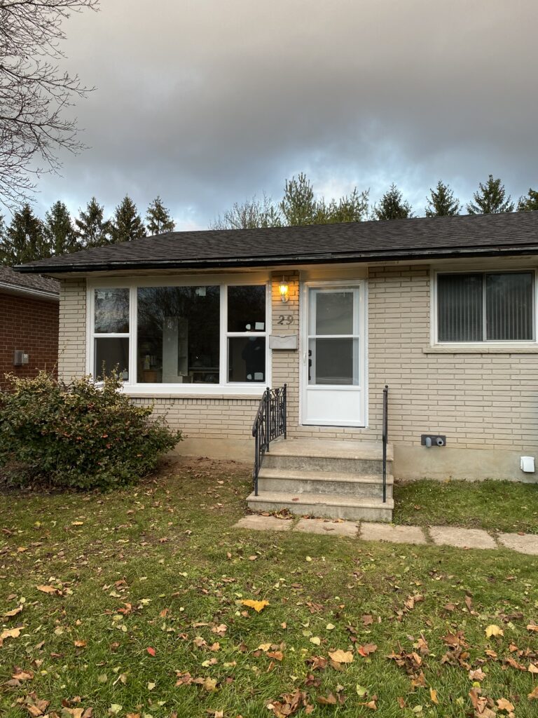 house with single hung windows and front exterior door