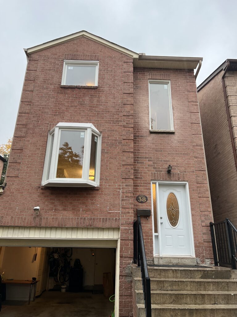 house with bay window and 1 sidelite door